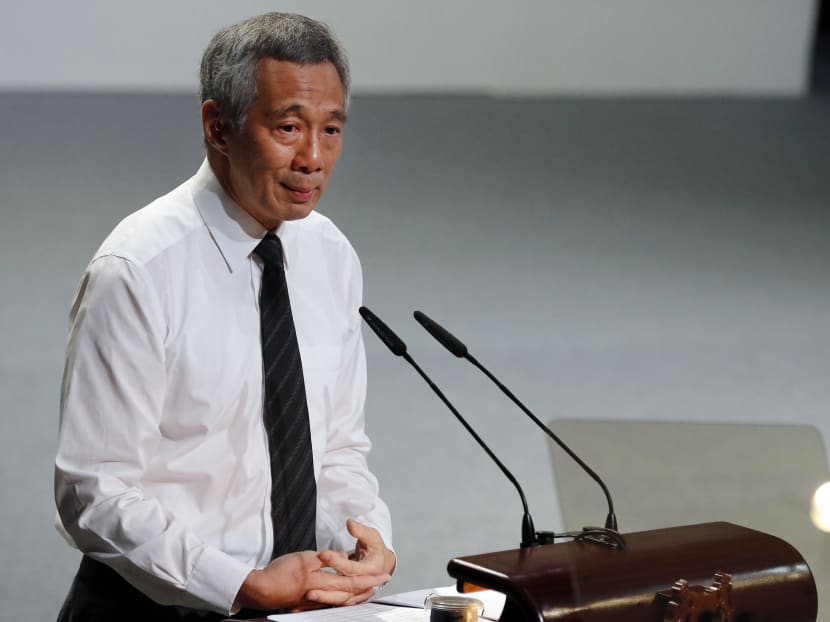 Singapore's Prime Minister Lee Hsien Loong, holds back his tears as he delivers his eulogy during a state funeral of the late Lee Kuan Yew, held at the University Cultural Centre, on Sunday, March 29, 2015. Photo: AP