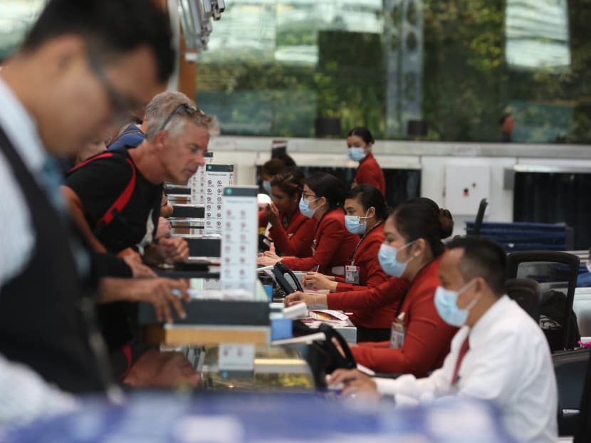 Travellers at a check-in counter at Changi Airport on Feb 6, 2020. Travellers at a check-in counter at Changi Airport on Feb 6, 2020.