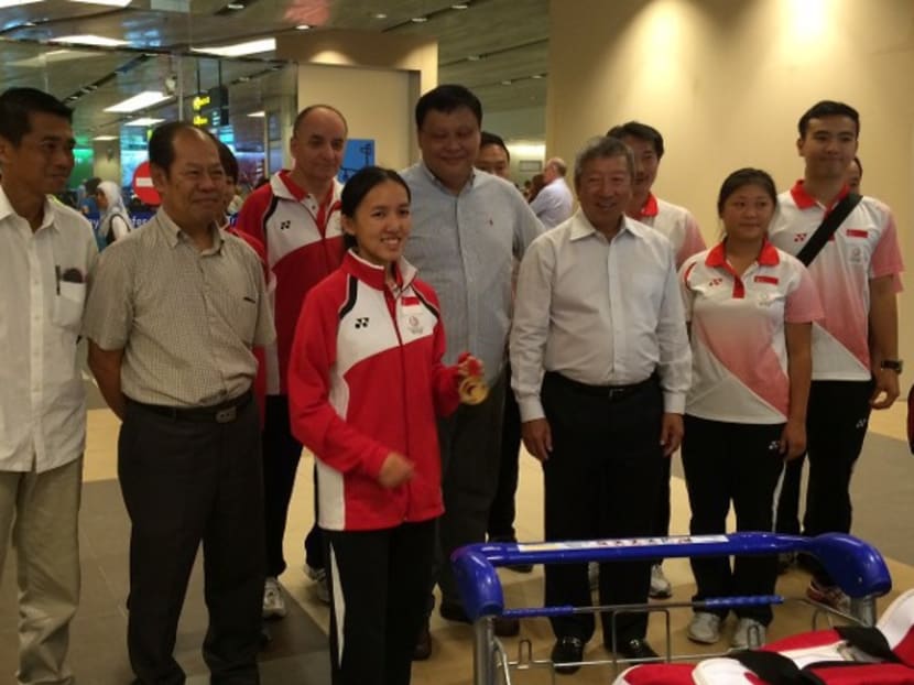 Team Singapore shooters welcomed by their family and supporters at Singapore Changi Airport. Photo: Alice Chia