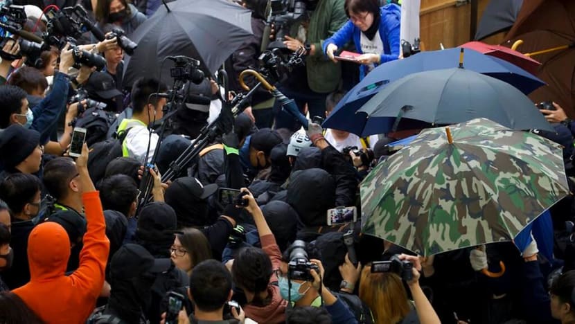 Officers beaten after police disband Hong Kong rally Officers beaten after police disband Hong Kong rally