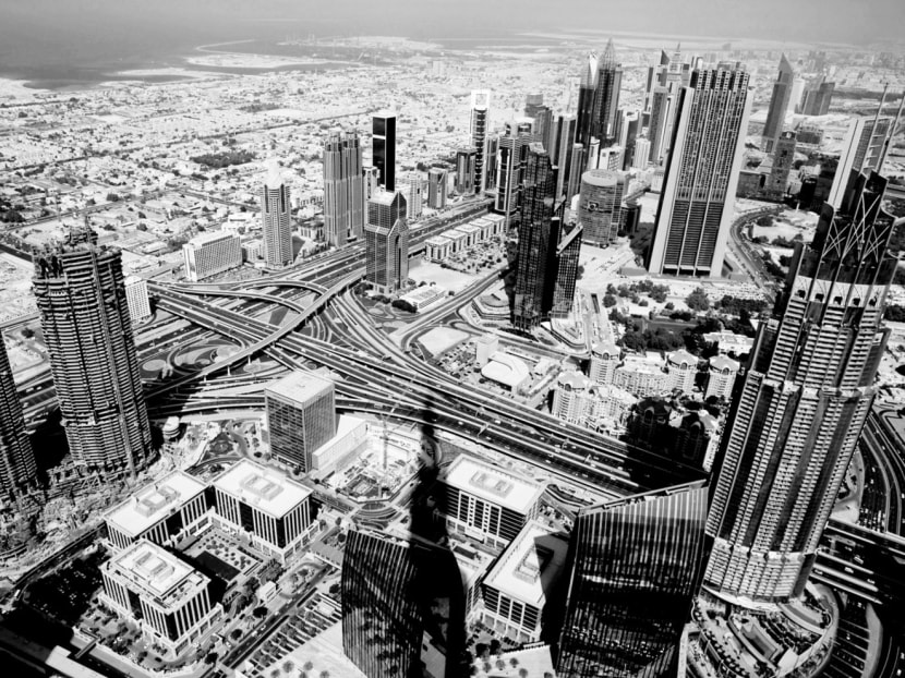 A general view of Dubai from the Burj Khalifa, the world’s tallest building. Dubai has complemented its competitive advantage in attracting highly skilled workers and investment with labour policies that also bring in lower-skilled foreign workers to power its growth engine. But a reliance on foreign workers could mean structural problems down the road. Photo: AP