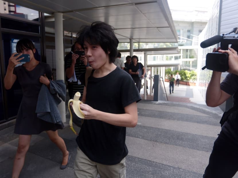 Amos Yee eating a banana as he enters the State Courts for his pre-trial conference on April 17, 2015. Photo: Jason Quah