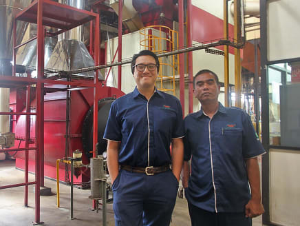 Writer Roy Jr Gan (left) at his company's coffee roasting facility in Surabaya, Indonesia. He is assistant vice-president of productions at PT Aneka Coffee Industry.