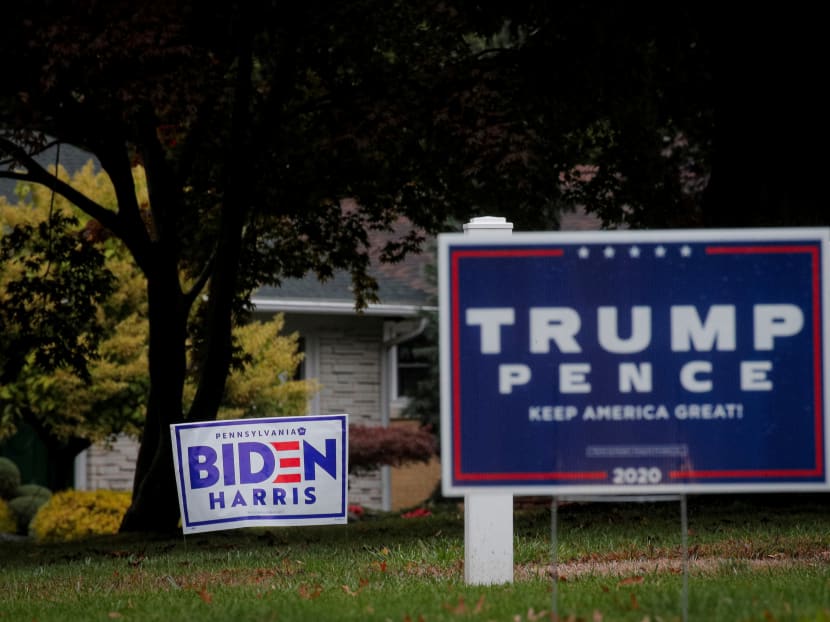 Campaign signs for US President Donald Trump and Democratic US presidential nominee and former Vice President Joe Biden are seen near an event at Erie International Airport in Erie, Pennsylvania, US, on Oct 20, 2020.