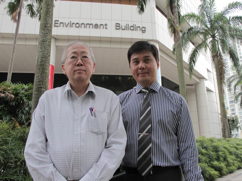 Mr Lee Eng Lock (left) and Mr Cheng Sin Yew of Trane in front of the Environment Building, which their company helped retrofit. Photo: Zara Zhuang