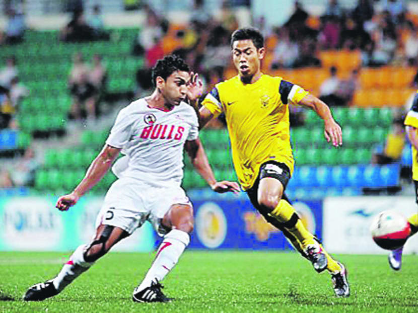 Adrian Dhanaraj (left) played for Gombak United and earned two caps for Singapore. Photo: FAS