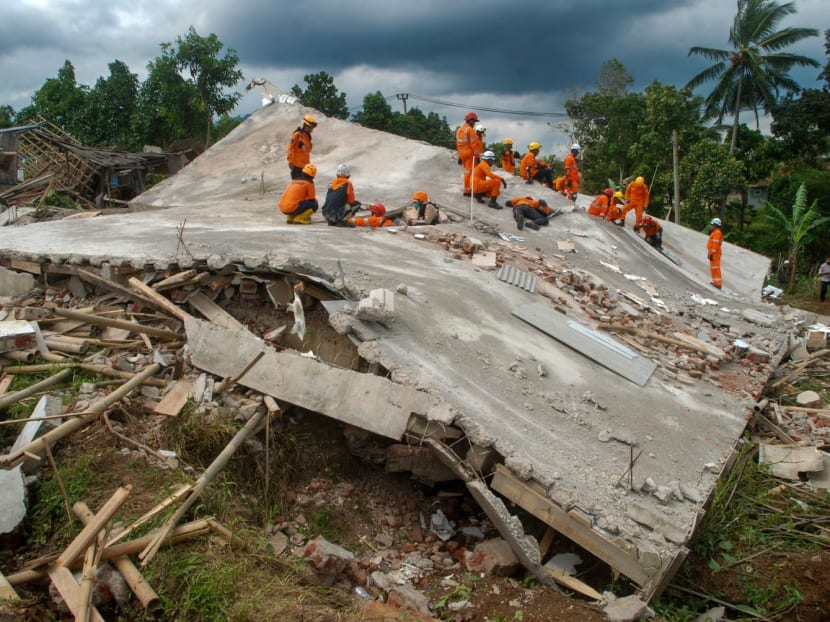 Rescue workers look for victims under the ruins of collapsed buildings in Cianjur on Nov 22, 2022, following a 5.6-magnitude earthquake. Rescue workers look for victims under the ruins of collapsed buildings in Cianjur on Nov 22, 2022, following a 5.6-magnitude earthquake.