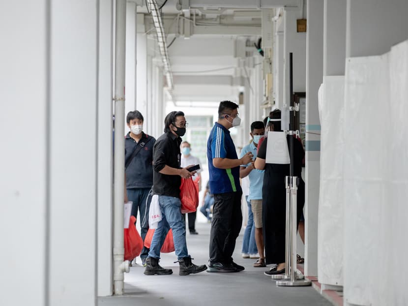 Residents living at Block 506, Hougang Avenue 8, queuing for a Covid-19 swab test at the block’s void deck on May 21, 2021.