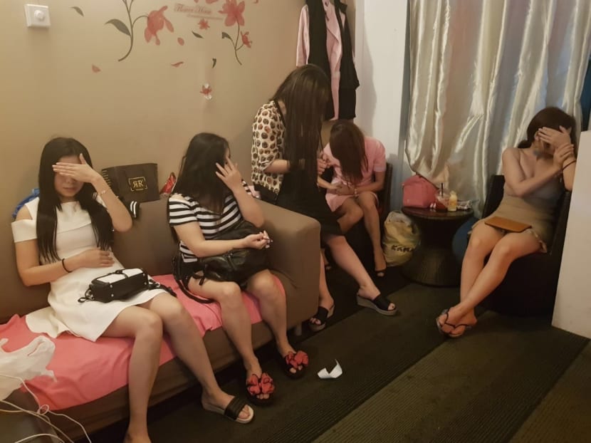 Eleven women were arrested by the police on Tuesday (Dec 12) in the latest in a series of enforcement operations against vice related activities in December. Photo: Singapore Police Force