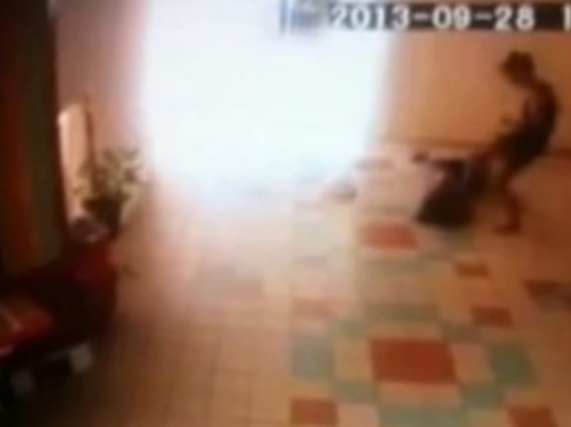 A screen shot from CCTV video of 41-year-old Casey Sabrina Ng alias Asha attacking an elderly.