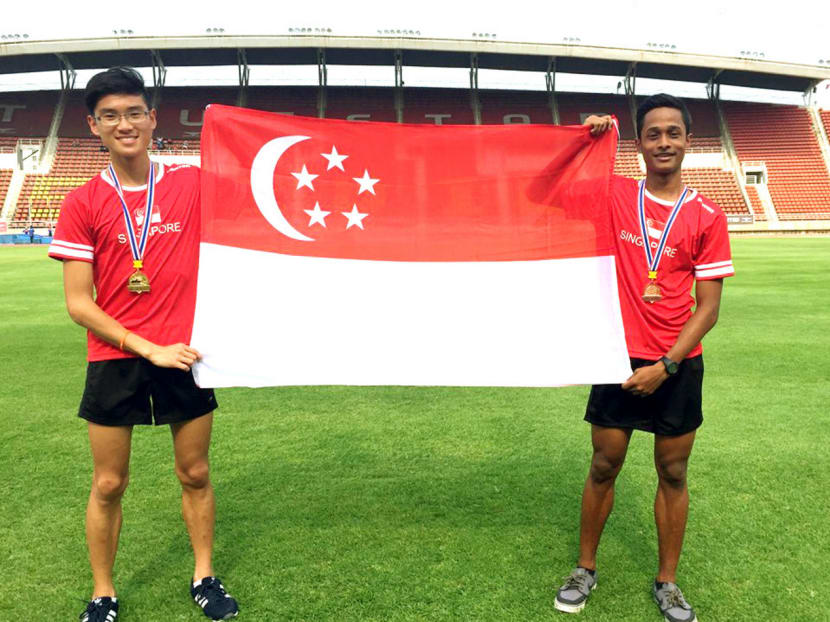 Lui Yuan Chow and team-mate Lerhan Muhammad after the men's 1,500 final at the 11th SEA Youth Athletics Championships. Photo: Lydia Lui