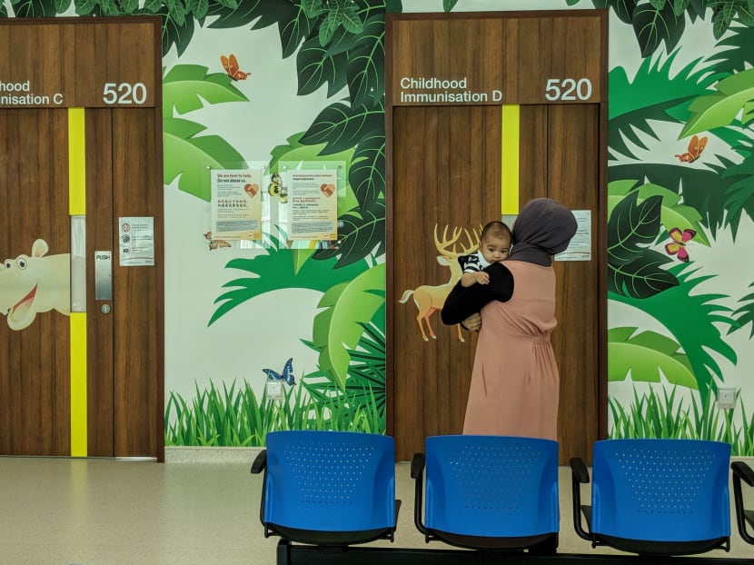 A mother and her child at the Punggol Polyclinic, which is part of the network of polyclinics under SingHealth. The healthcare group was the target of a major cyber attack in late June and early July, and investigations are still ongoing. TODAY file photo