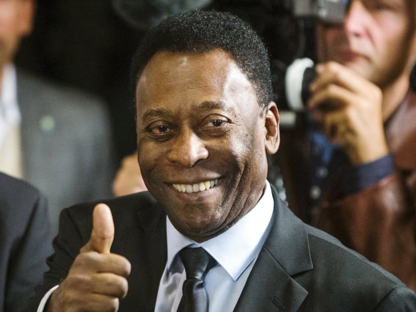 Former Brazilian soccer star Pele poses for photograph after he ceremonially turned on the lights of the Empire State Building in New York in this April 17, 2015 file photo. Photo: Reuters