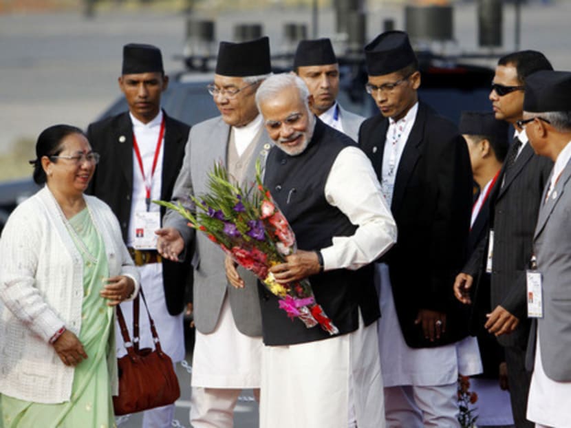 India’s Prime Minister Narendra Modi receiving a bouquet upon his arrival in Kathmandu yesterday for the SAARC summit. Mr Modi has no plans to meet Pakistani Prime Minister Nawaz Sharif at this week’s meetings. Photo: Reuters