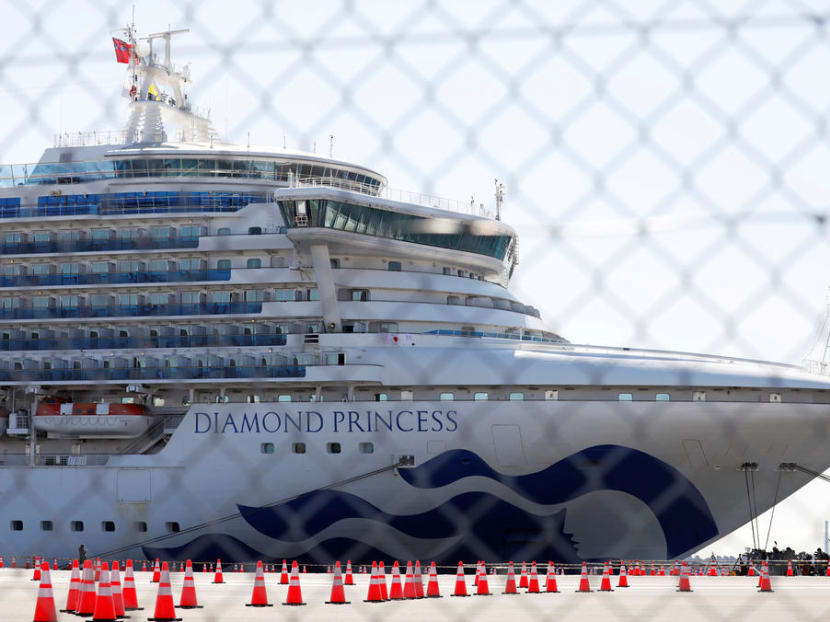 The cruise ship Diamond Princess is seen through steel fence at Daikoku Pier Cruise Terminal in Yokohama.