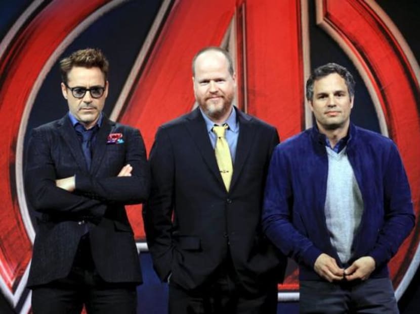 Director Joss Whedon poses with cast members Robert Downey Jr (left) and Mark Ruffalo (right) at a news conference for Avengers: Age of Ultron in Beijing, April 19, 2015. Photo: Reuters