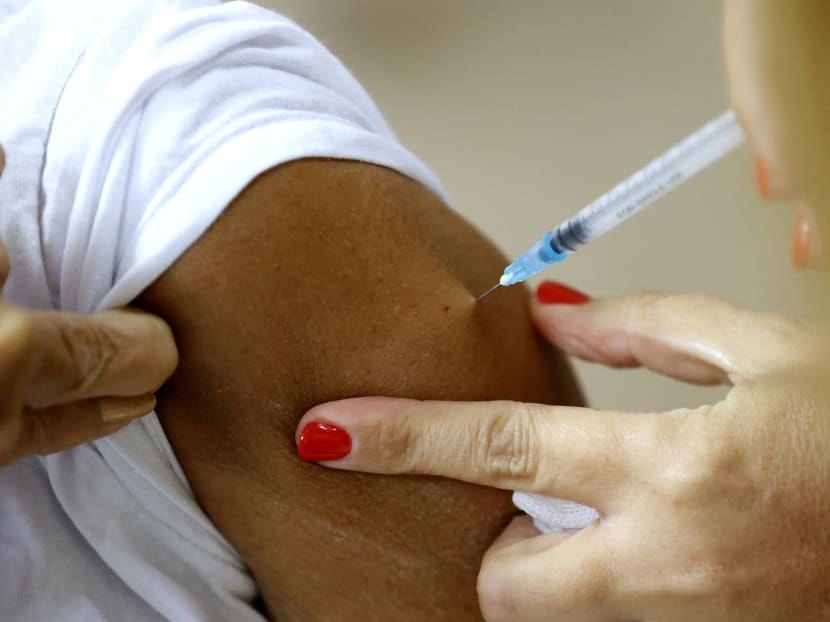 A patient receives a third dose of the Pfizer-BioNTech Covid-19 coronavirus vaccine at the outpatient clinics of the Cardiovascular Centre at Sheba Medical Center near Tel Aviv, Israel, on July 12, 2021.