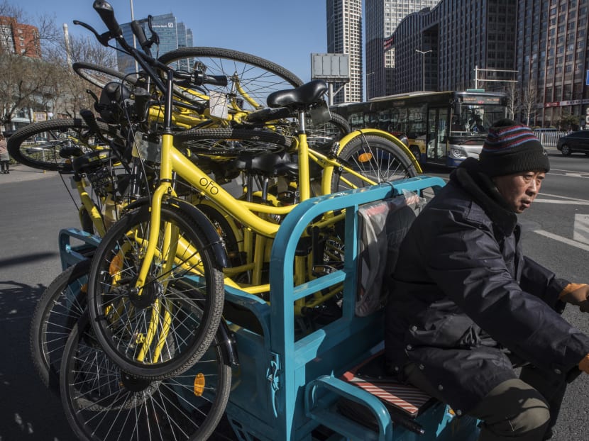 Yellow bikes from Ofo, a pioneer of China’s bike-share boom, are collected in Beijing. Ofo is facing serious financial problems as of December 20187 — its founder is on a government blacklist for unpaid bills and millions of riders who placed deposits are demanding their money back.