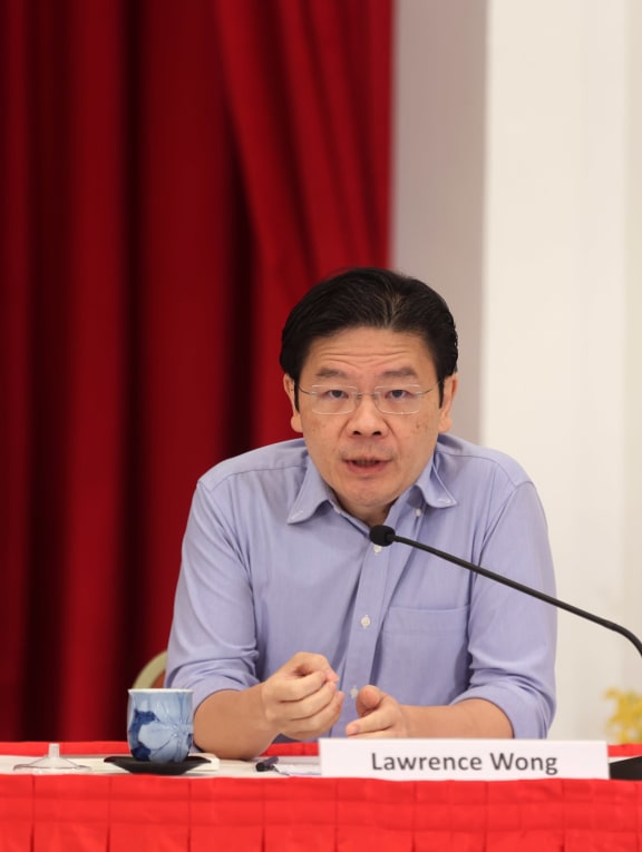 Finance Minister Lawrence Wong speaking during the press conference at the Istana on April 16, 2022.