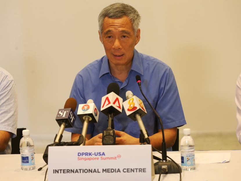 PM Lee speaking to the media after his visit to the International Media Centre.