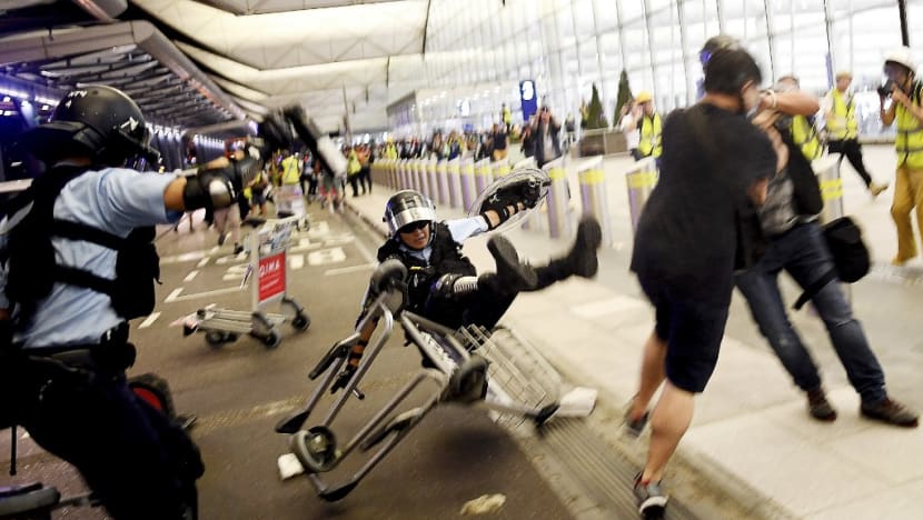 In photos: Hong Kong airport protests turn violent after standoff over suspected undercover officer In photos: Hong Kong airport protests turn violent after standoff over suspected undercover officer
