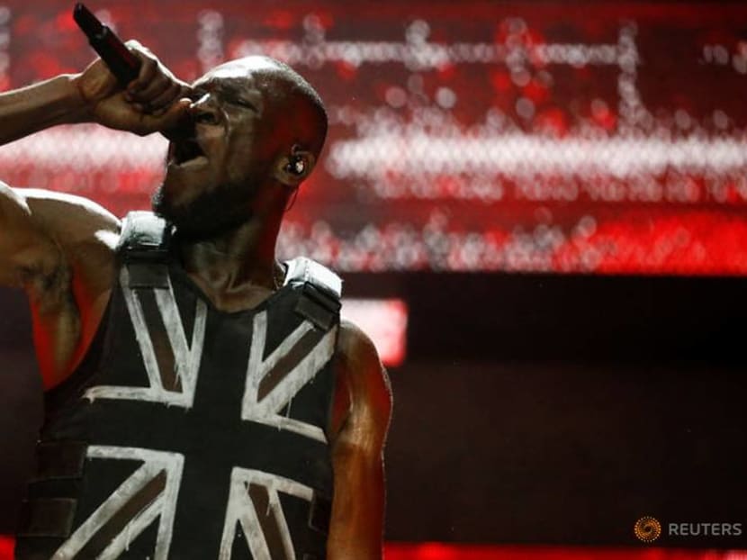 Street artist Banksy designs stab-proof vest for British rapper at Glastonbury Street artist Banksy designs stab-proof vest for British rapper at Glastonbury