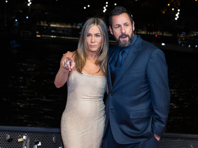 Jennifer Aniston says Adam Sandler teases her dating choices: "What are you doing?"