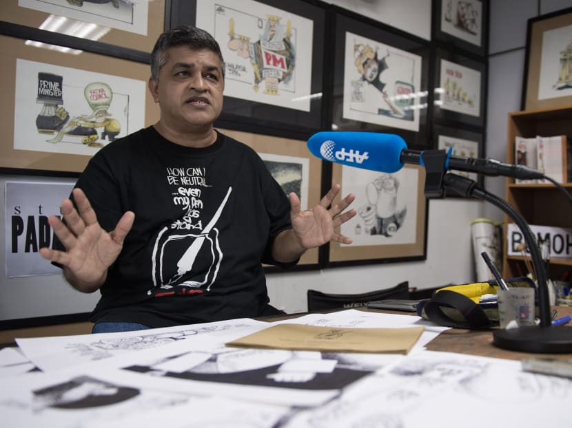 This file photo taken on April 13, 2015 shows Zulkiflee Anwar Ulhaque (Zunar), 52, speaking at his office in Kuala Lumpur. Photo: AFP