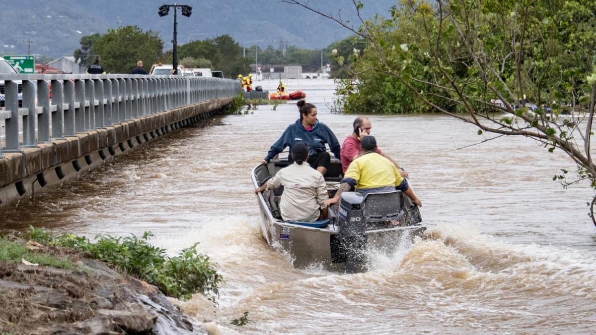 Rescue teams evacuate flood-ravaged Australian town