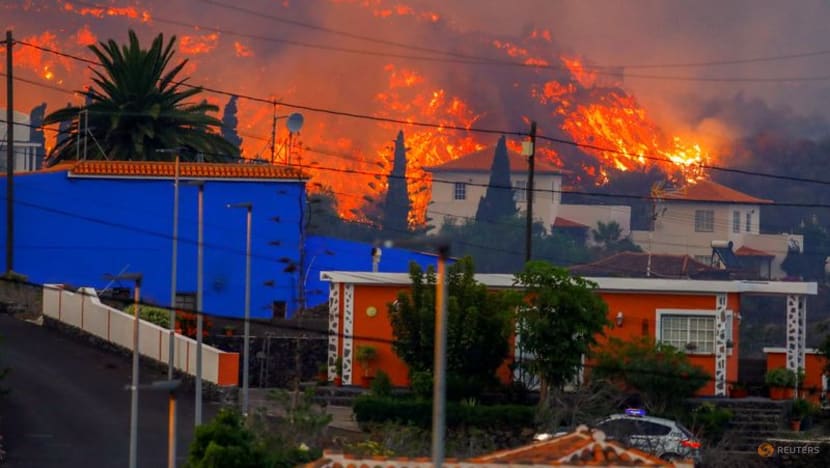 Thousands flee as lava spewing from volcano on Spain's La Palma island destroys houses Thousands flee as lava spewing from volcano on Spain's La Palma island destroys houses
