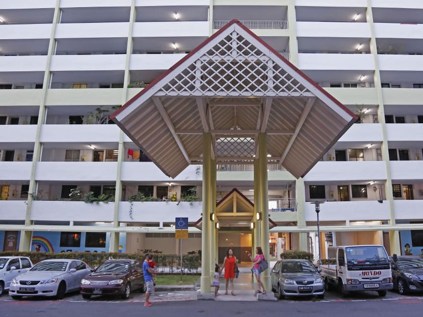 Residents stand under an HDB block in Gloucester Road. TODAY file photo Residents stand under an HDB block in Gloucester Road. TODAY file photo