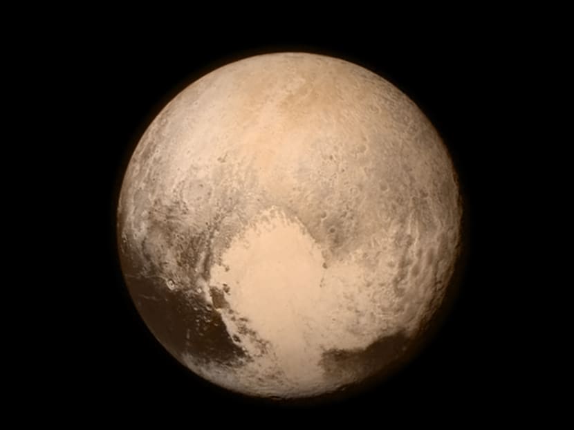 Pluto up close: Spacecraft achieves flyby, then calls home
