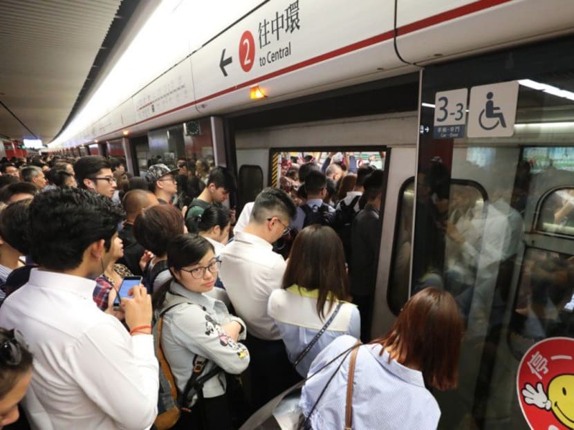 Photo of the day: Commuters trying to squeeze onto packed trains at Mong Kok station in Hong Kong after signalling faults delayed trains on an unprecedented four lines on Tuesday (Oct 16).