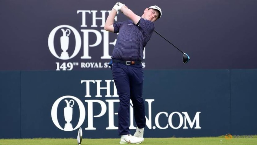 Golf-Macintyre makes hay in sun, but Royal St George's course bites back