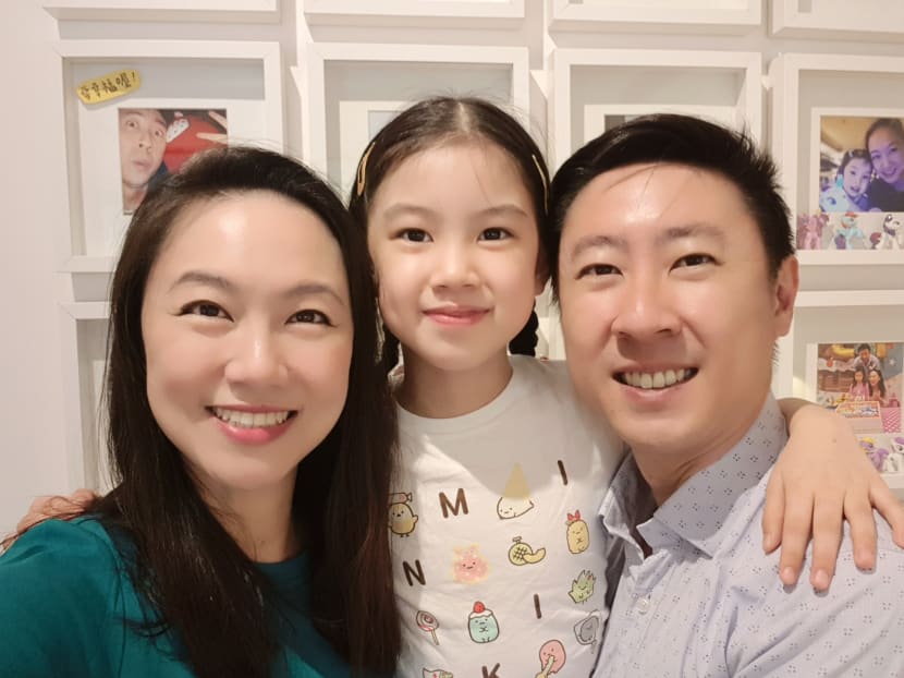 The author, seen here with her daughter and husband, says that when her daughter was three years old, she could easily count from one to 20 in English but could only count up to 10 in Mandarin.
