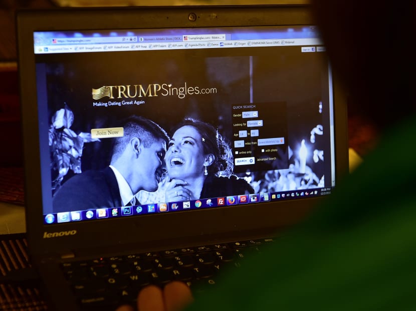 This photo illustration shows a woman checking out TrumpSingles.com online at her computer in Los Angeles, California on Dec 2, 2016. Photo: AFP