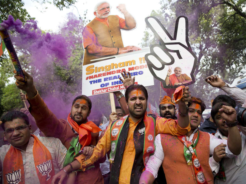 Bharatiya Janata Party (BJP) supporters celebrating the party’s state election wins on Saturday. The strength of Indian Prime Minister Narendra Modi’s mandate shows his appeal remains powerful nearly three years after he swept to power. Photo: AP