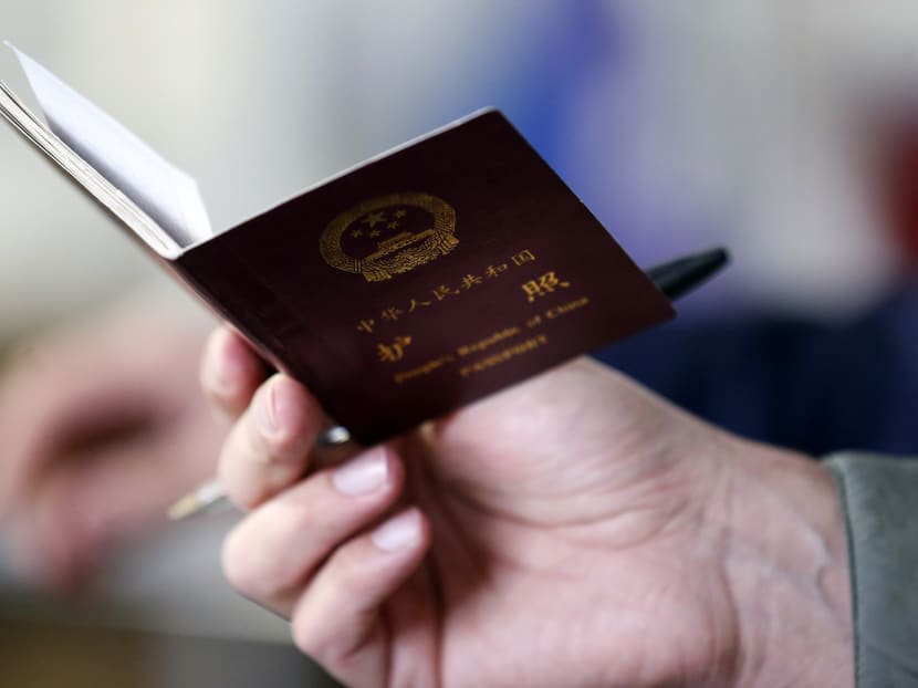 A man holding a Chinese passport. A corruption crackdown at a powerful Chinese state-owned enterprise has spilled over into Hong Kong, where employee passports were seized in the latest sign of the extraterritorial reach of China’s Communist party.