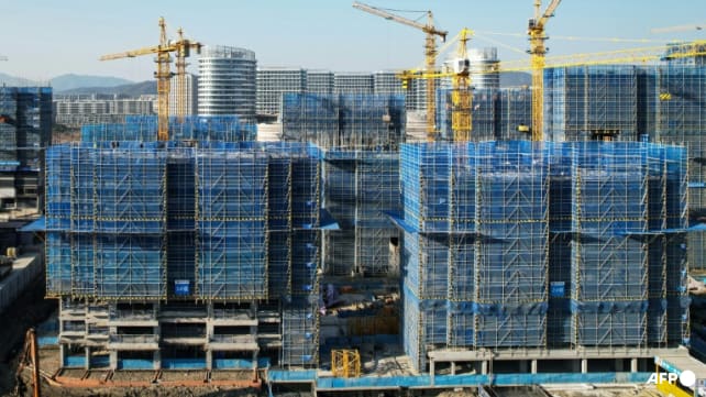China pledges to buy apartments and finish stalled housing projects