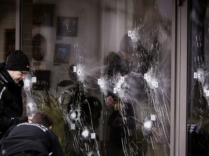 Police technicians work next to the door to Krudttoenden in Oesterbro, Copenhagen, today (Feb 15). Photo: Reuters