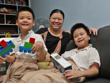 Madam Lim Pei Hoon with her sons Hao Ping (L) and Hao Zheng.
