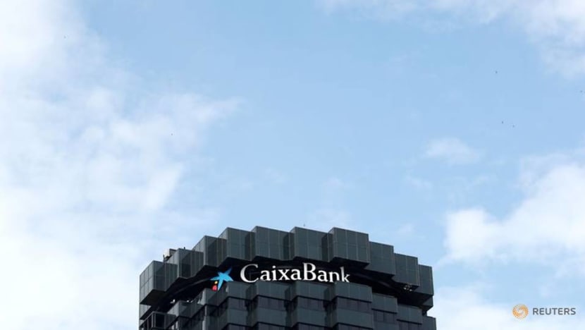 Caixabank shareholders pave way to create Spain's biggest bank with Bankia Caixabank shareholders pave way to create Spain's biggest bank with Bankia
