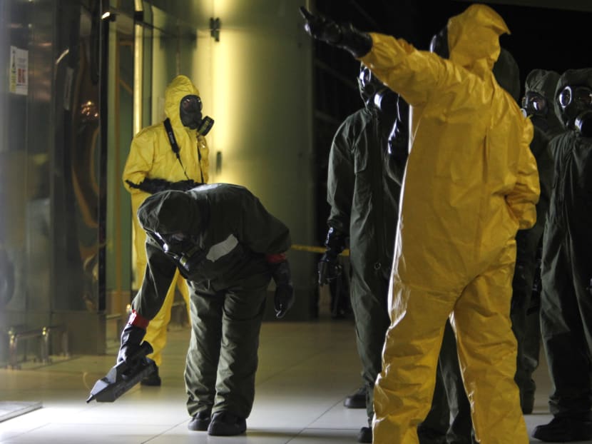 A hazmat crew scan the decontamination zone at Kuala Lumpur International Airport 2 in Sepang, Malaysia on Sunday, Feb. 26, 2017. Malaysian police ordered a sweep of Kuala Lumpur airport for toxic chemicals and other hazardous substances following the killing of Kim Jong Nam. Photo: AP