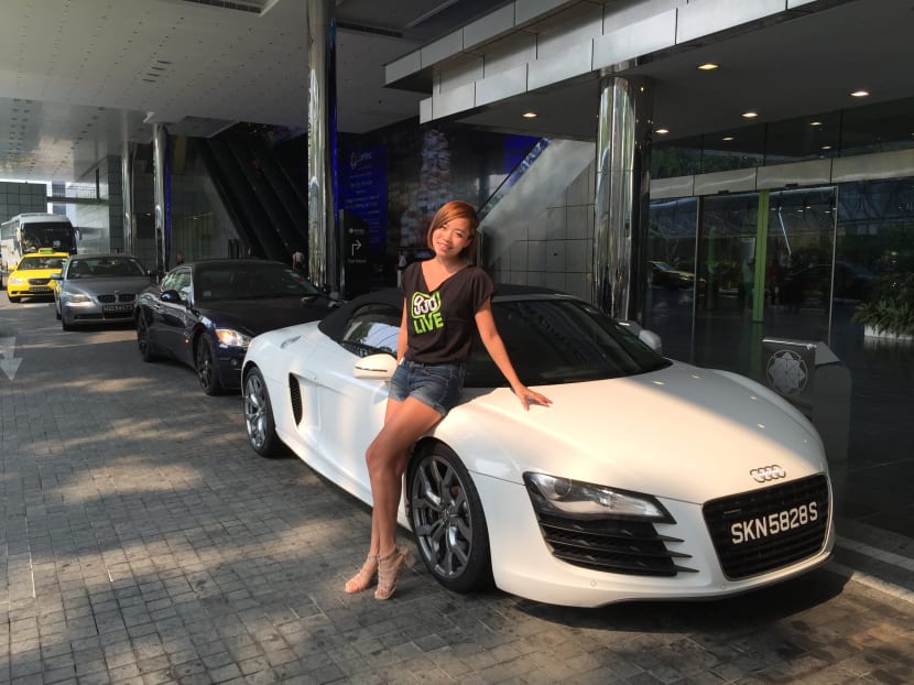 938Live DJ Angela Lim standing with the Lamborghini Gallardo Spyder. Photo: Joy Fang