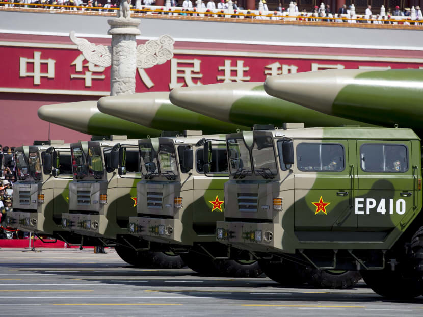 Military vehicles carrying DF-26 ballistic missiles travel past Tiananmen Gate during a military parade to commemorate the 70th anniversary of the end of World War II in Beijing Thursday Sept 3, 2015. Photo: Reuters