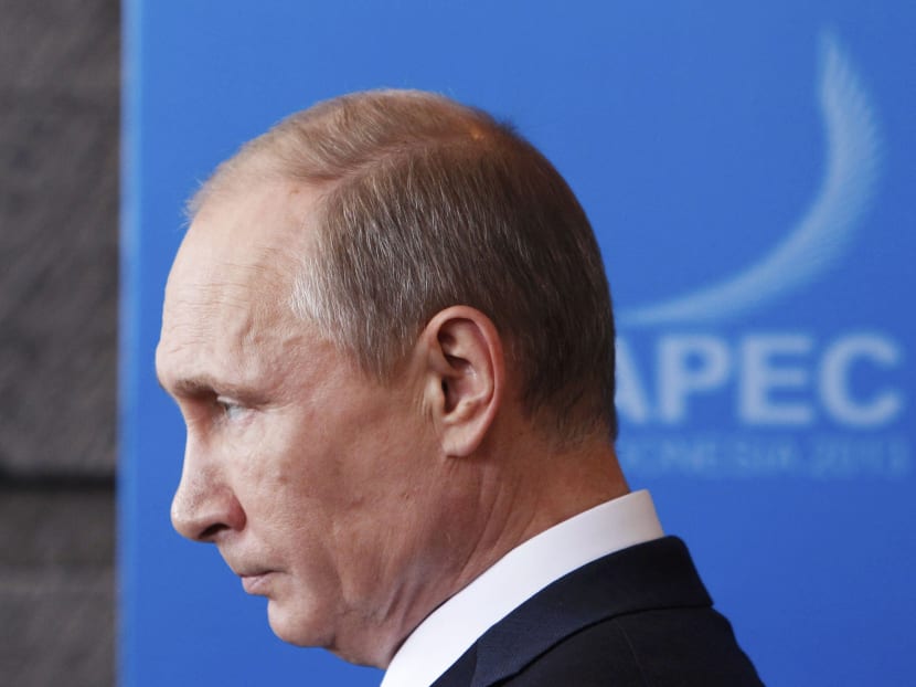 President Vladimir Putin allowed a small circle of businessmen to keep Russia's post-communist most prized assets in exchange for their political loyalty. Photo: Reuters