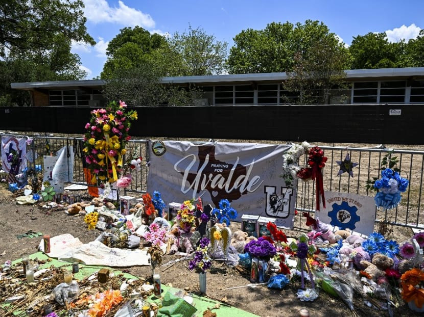 Mementos decorate a makeshift memorial to the victims of a shooting at Robb Elementary School in Uvalde, Texas, on June 30, 2022.