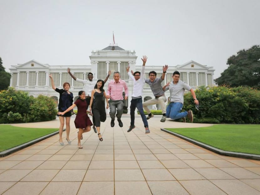 In this photo uploaded on Facebook, Mr Lee attempted a jump shot with students from Nanyang Technological University. Photo: Lee Hsien Loong/Facebook