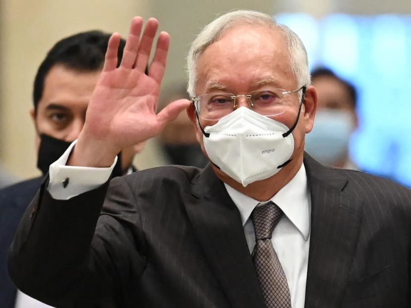 Malaysia's former prime minister Najib Razak waves as he arrives at the federal court in Putrajaya on Aug 18, 2022.