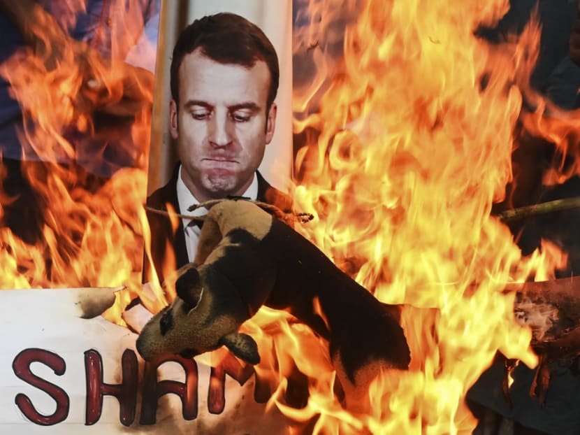 Protesters burn an effigy of French president Emmanuel Macron during an anti-France demonstration in Kolkata on Wednesday, Nov 4, 2020.